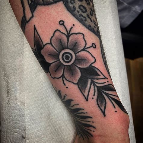 flower tattoo on the side|traditional style flower tattoos.